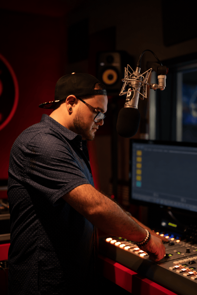 Brainchild working at a radio studio console